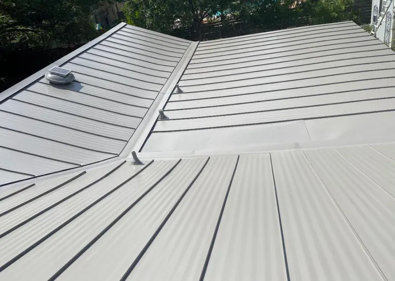 Solar attic fan installed on a metal roof for Roof Ventilation in West Allis